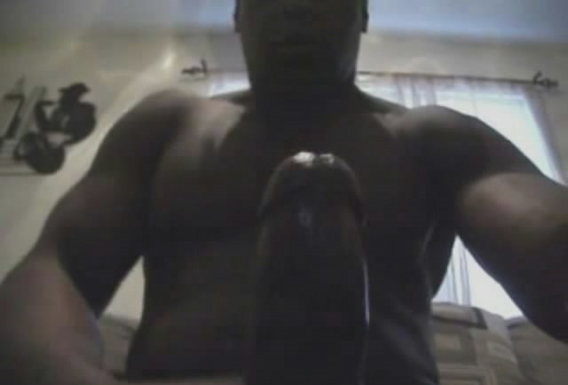 Stroking his huge black dick till he cums